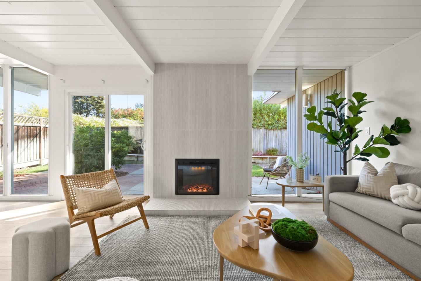 2443 Thaddeus Drive Mountain View, CA 94043 - Photo 3 of 38 a living room with furniture a fireplace and a potted plant
