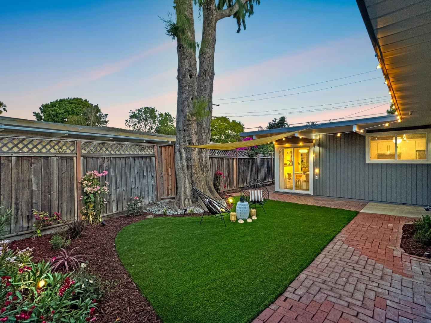 2443 Thaddeus Drive Mountain View, CA 94043 - Photo 31 of 38 a view of a chair and table in backyard of the house