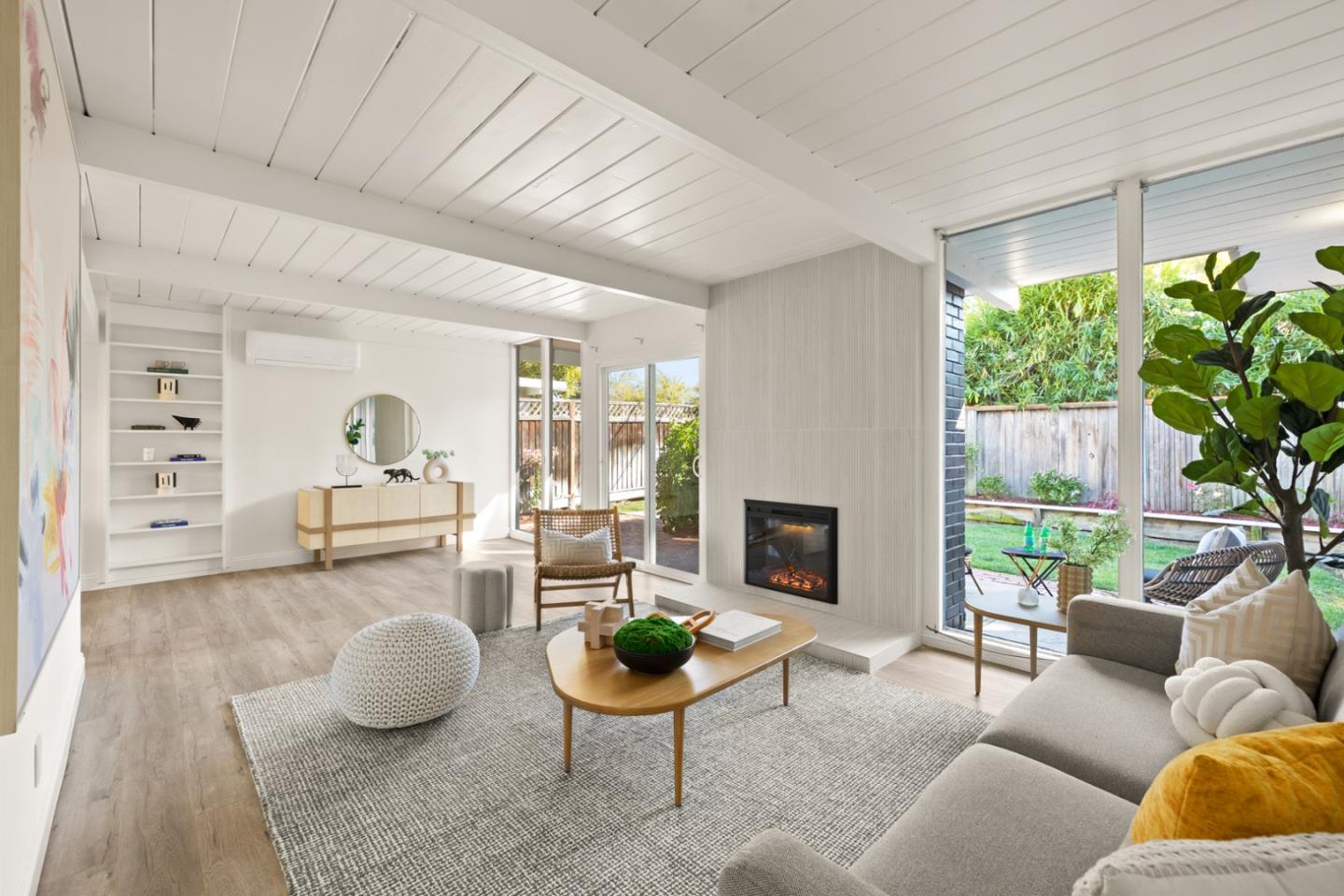 2443 Thaddeus Drive Mountain View, CA 94043 - Photo 4 of 38 a living room with furniture potted plant and a fireplace