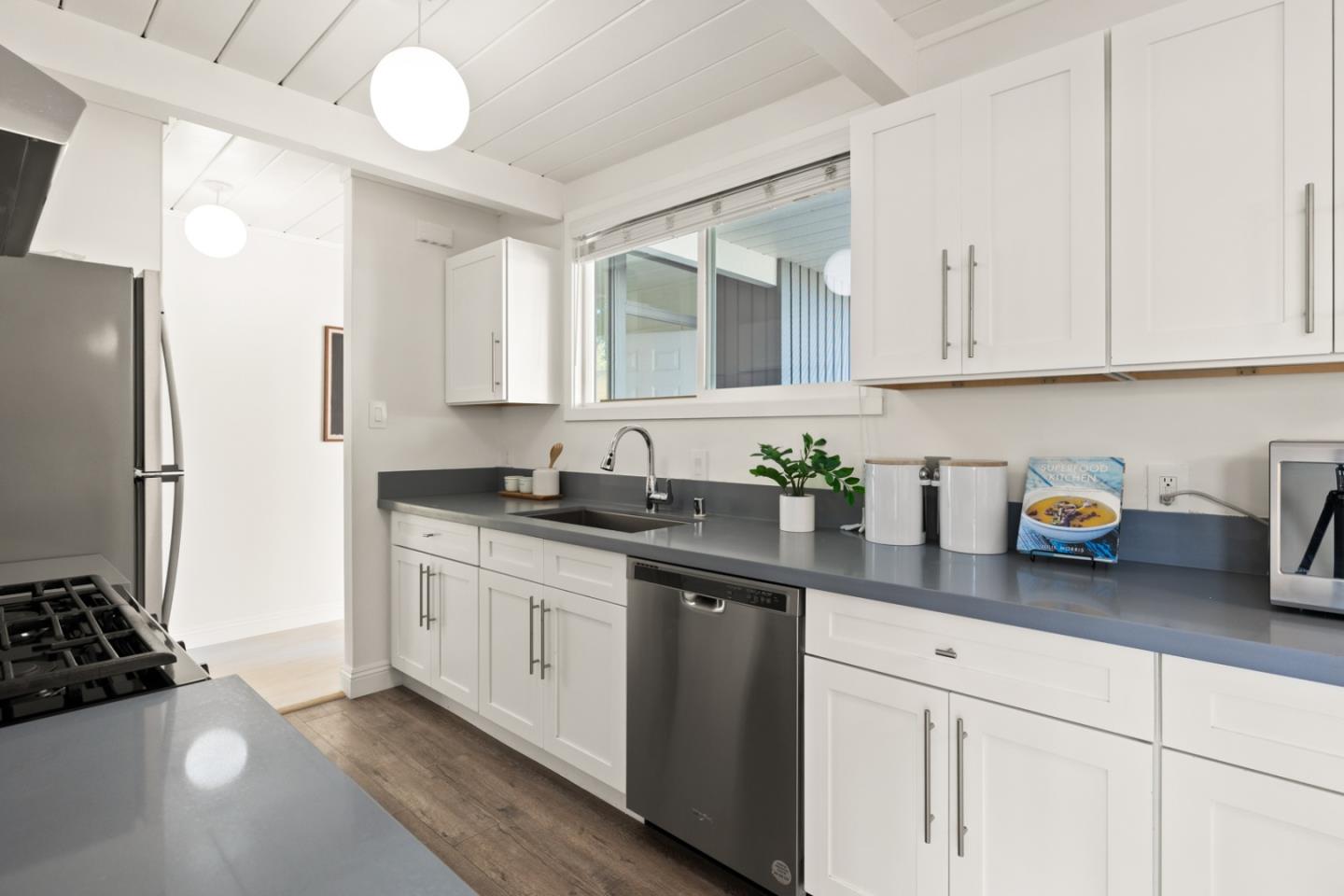 2443 Thaddeus Drive Mountain View, CA 94043 - Photo 9 of 38 a kitchen with stainless steel appliances granite countertop a sink stove and refrigerator