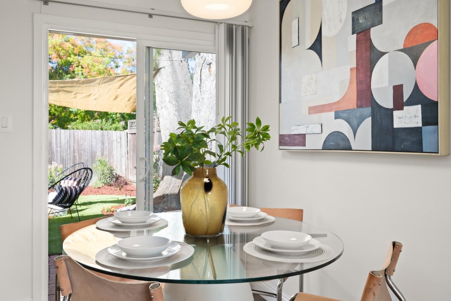2443 Thaddeus Drive Mountain View, CA 94043 - Photo 10 of 38 a dining room with furniture and a potted plant