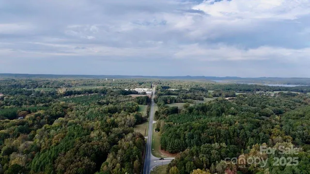 an aerial view of a city and mountain