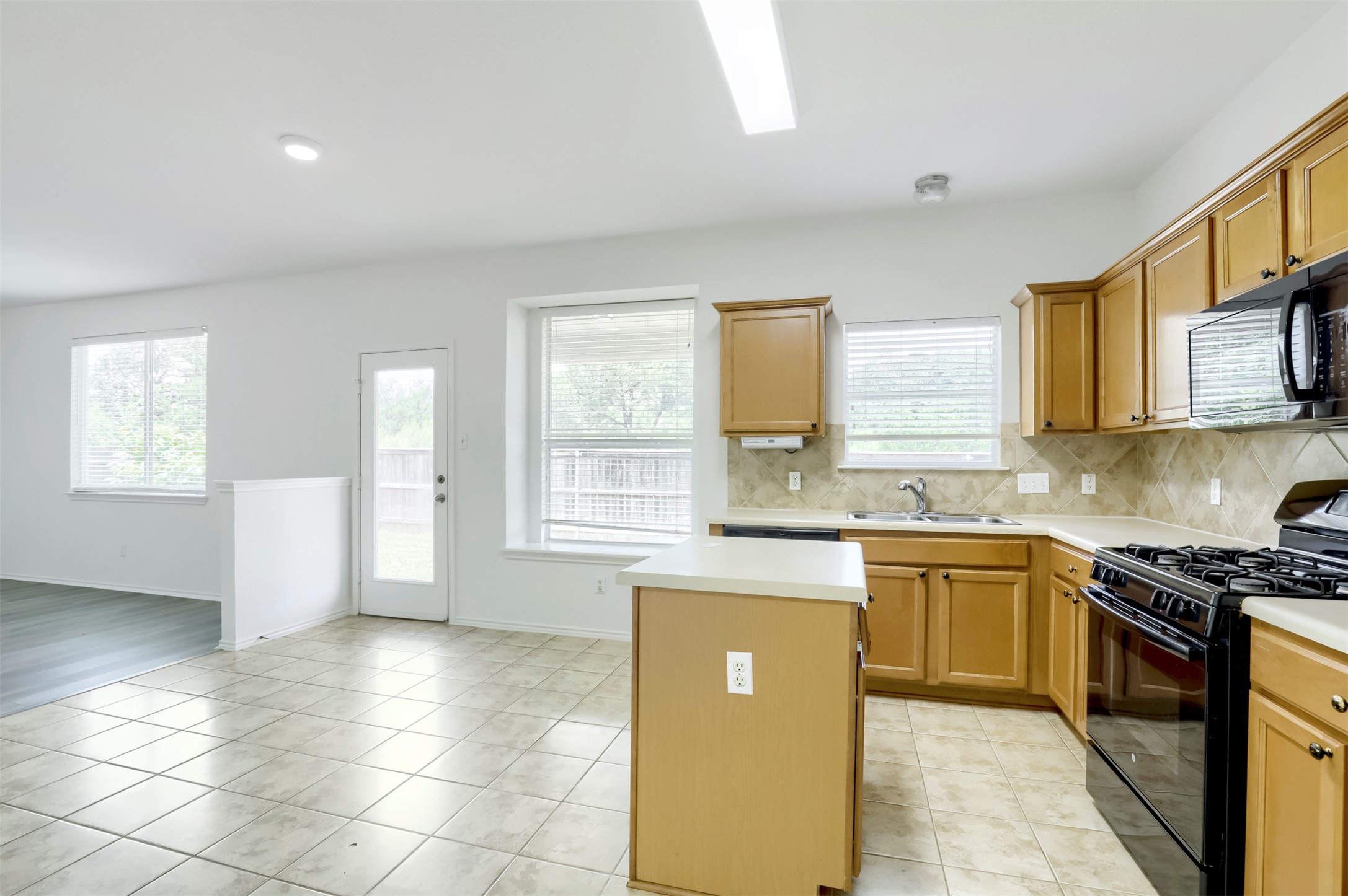 4125 Pebble Ridge Cove Round Rock, TX 78681 - Photo 11 of 30 An inviting kitchen with a central island and contemporary appliances, ideal for everyday living.
