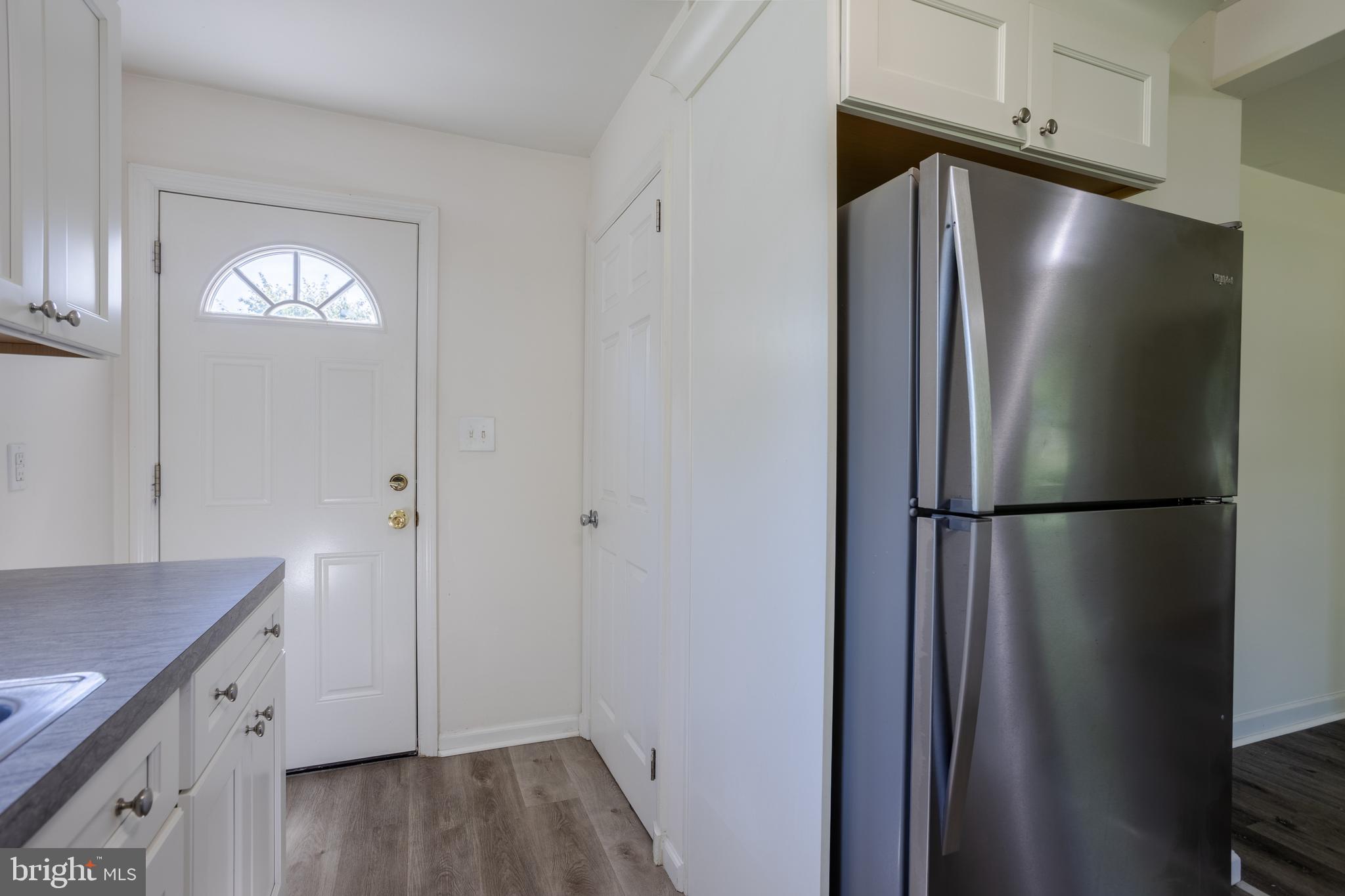 3612 Churchville Road Aberdeen, MD 21001 - Photo 13 of 49 a view of a refrigerator in kitchen and a wooden cabinets