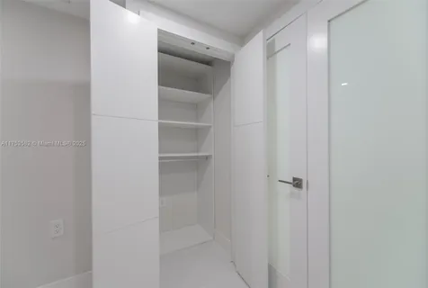 a bathroom with a toilet sink and a mirror