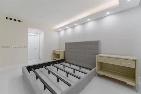 a bathroom with a shower sink vanity mirror and toilet