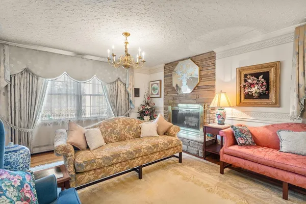 a spacious bedroom with a bed and a view of living room