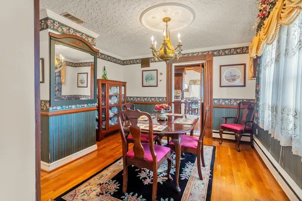 a large kitchen with stainless steel appliances granite countertop a large stove a sink dishwasher and cabinets with wooden floor
