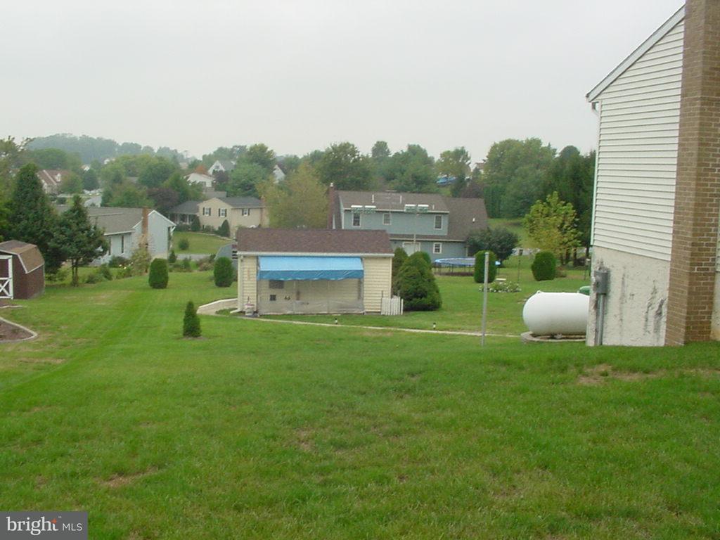 726 West Brubaker Valley Road Lititz, PA 17543 - Photo 3 of 3 a view of a chair and table of the back yard of the house