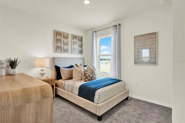 a bedroom with double bed and a window