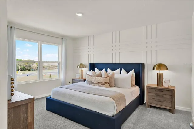 a bedroom with bed and window