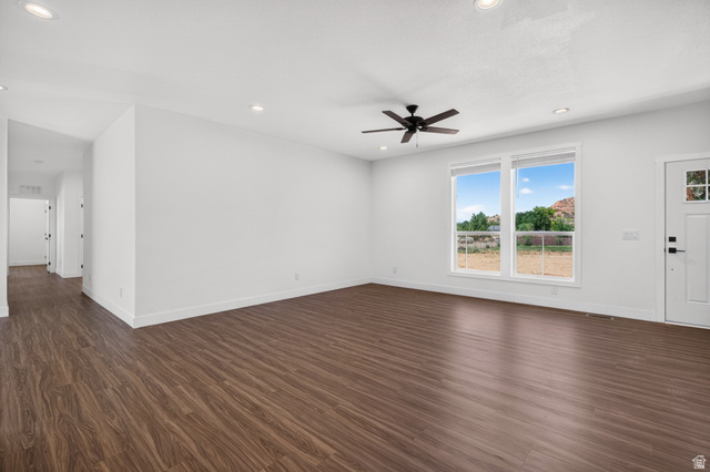 464 Jessop Avenue Hildale, UT 84784 - Photo 14 of 73 Spacious living area featuring wood-finish flooring, white walls, and recessed lighting