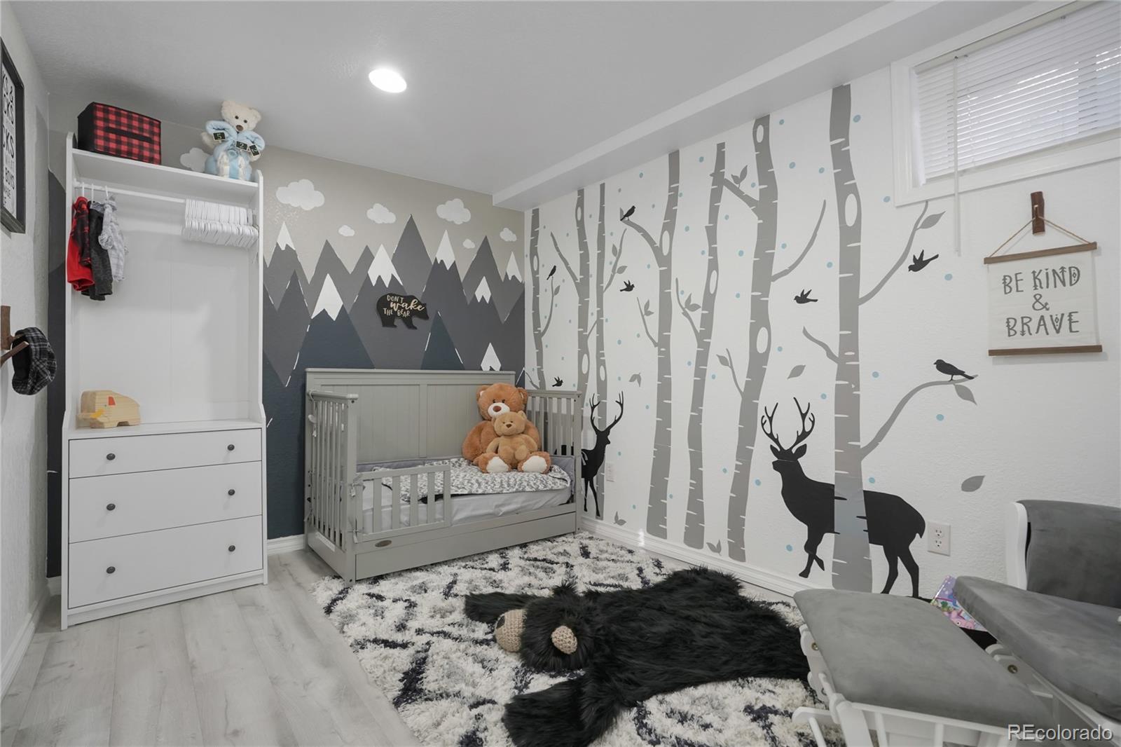 9201 West 104th Place Westminster, CO 80021 - Photo 15 of 29 a bedroom with a bed and a window