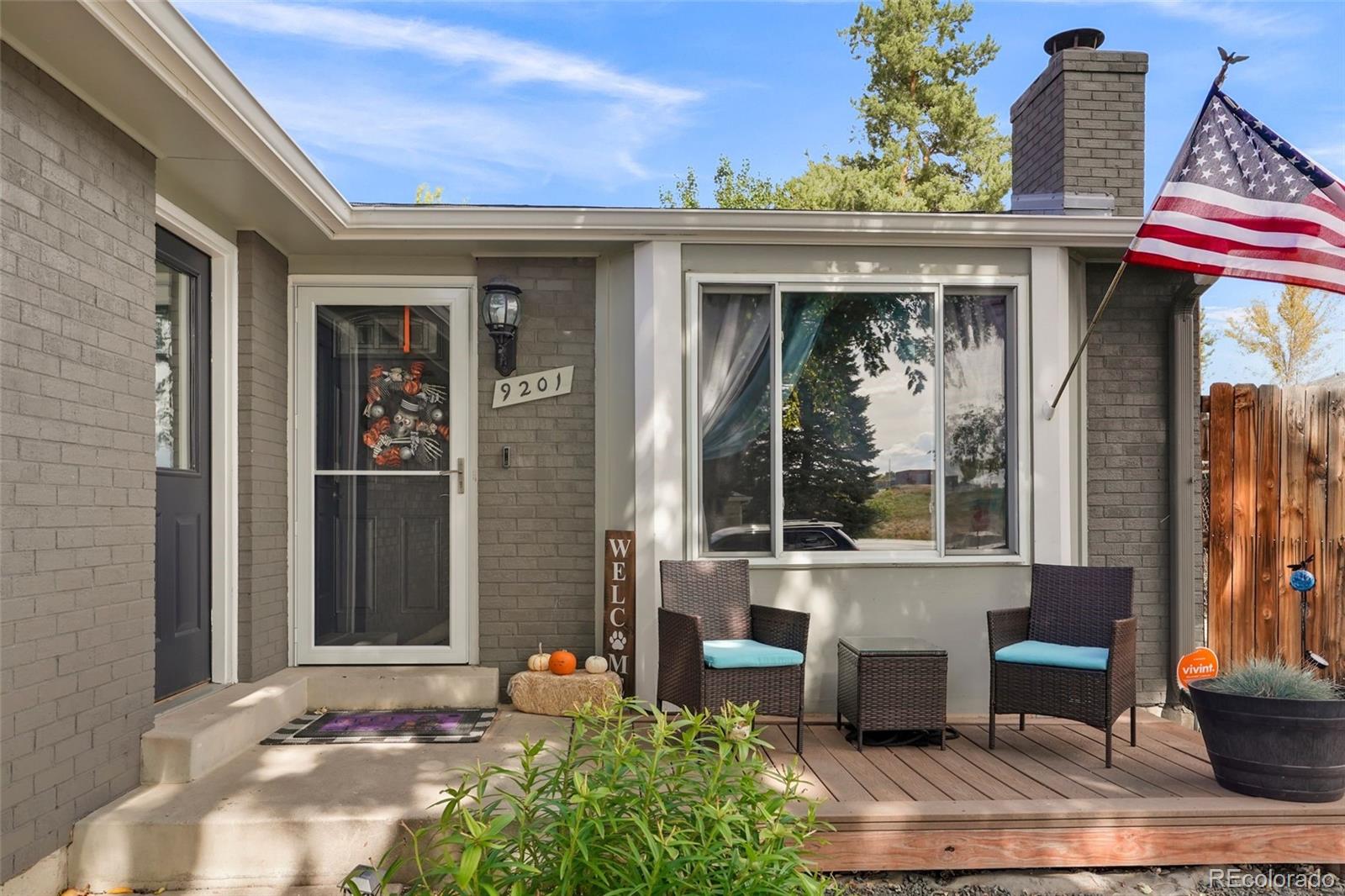 9201 West 104th Place Westminster, CO 80021 - Photo 2 of 29 a front view of a house with outdoor seating
