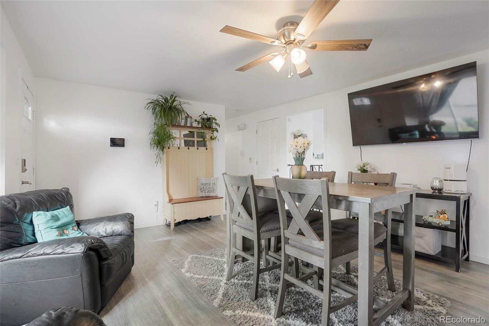 9201 West 104th Place Westminster, CO 80021 - Photo 5 of 29 a view of a dining room with furniture
