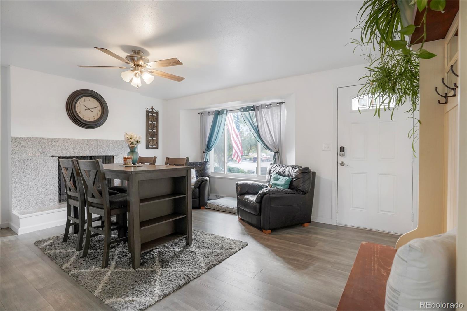 9201 West 104th Place Westminster, CO 80021 - Photo 10 of 29 a living room with furniture and a window