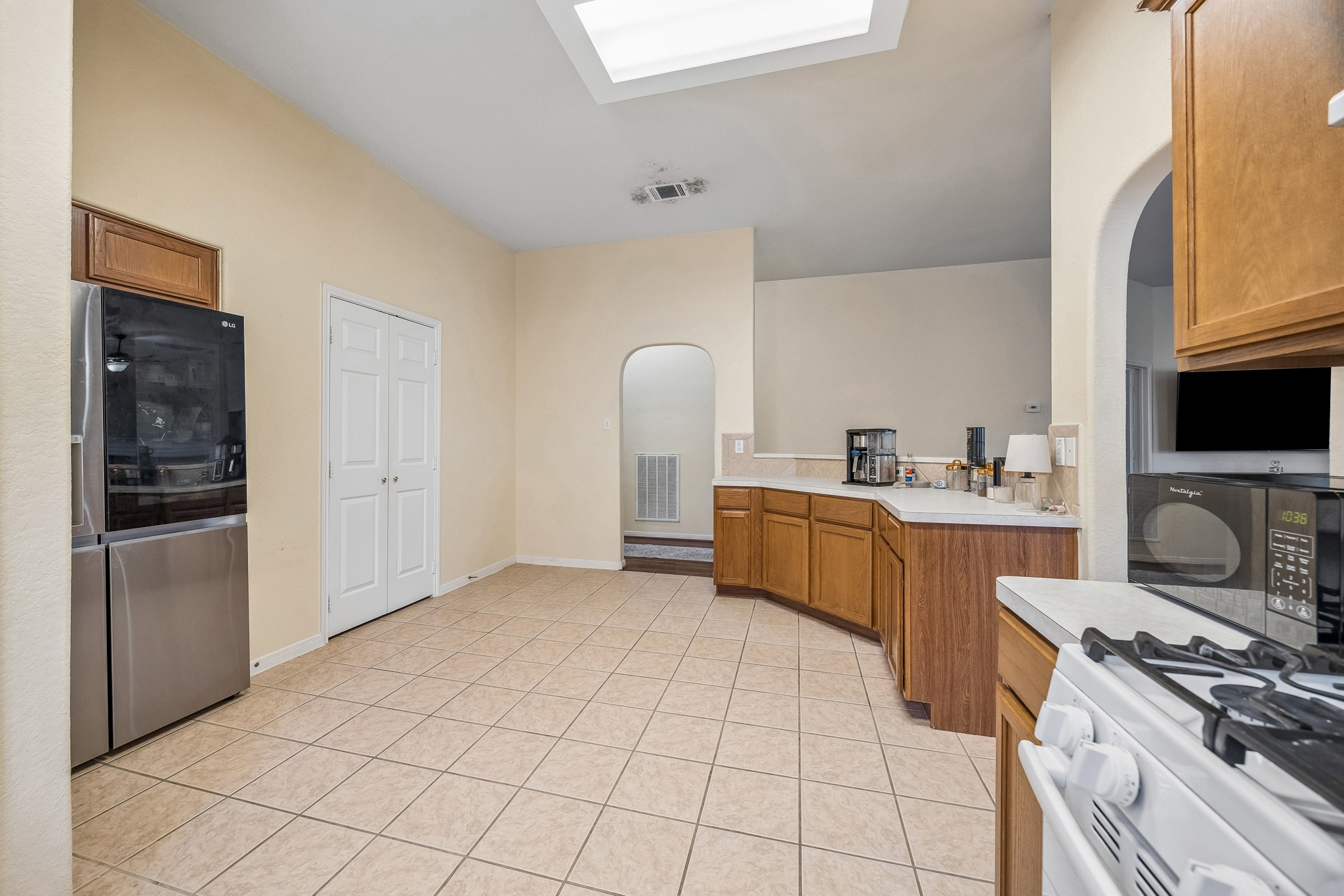 24027 Floragate Drive Spring, TX 77373 - Photo 12 of 21 a kitchen with a sink a stove and cabinets