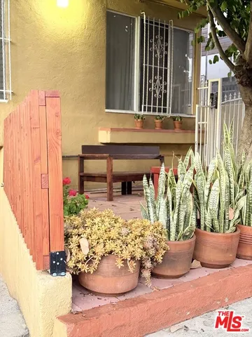 a view of a chairs and table on the roadside