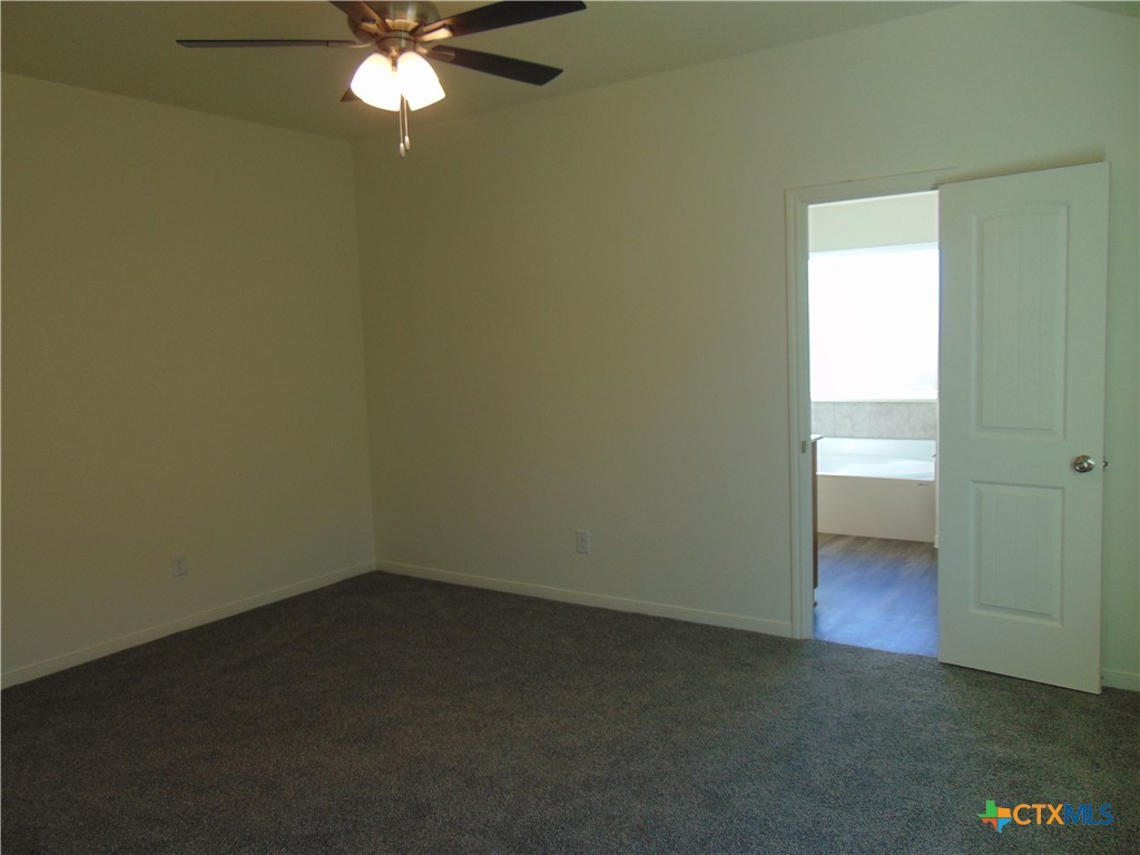 3202 Salt Fork Drive Killeen, TX 76549 - Photo 13 of 25 an empty room with a fan & a window