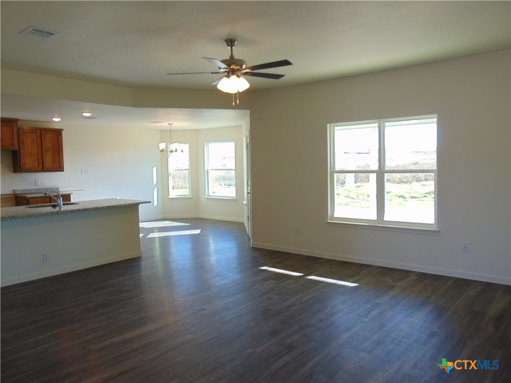 3202 Salt Fork Drive Killeen, TX 76549 - Photo 3 of 25 a view of an empty room with wooden floor and a window