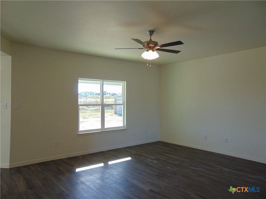 3202 Salt Fork Drive Killeen, TX 76549 - Photo 4 of 25 a view of empty room with wooden floor and fan