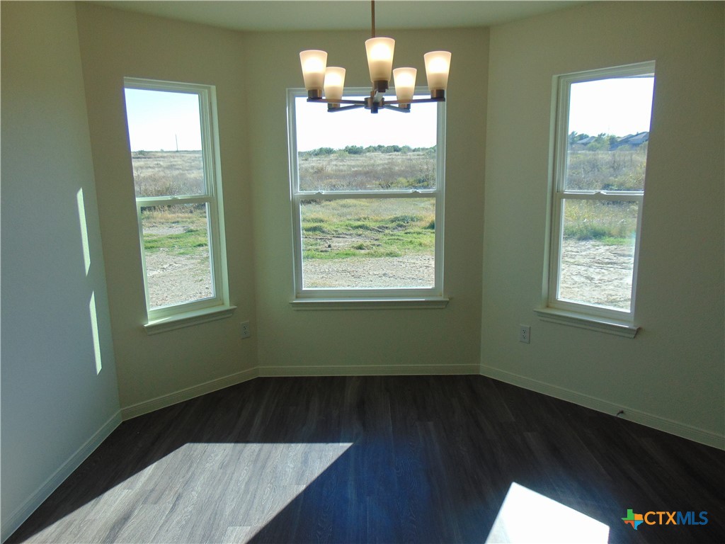 3202 Salt Fork Drive Killeen, TX 76549 - Photo 9 of 25 a view of empty room with wooden floor and fan