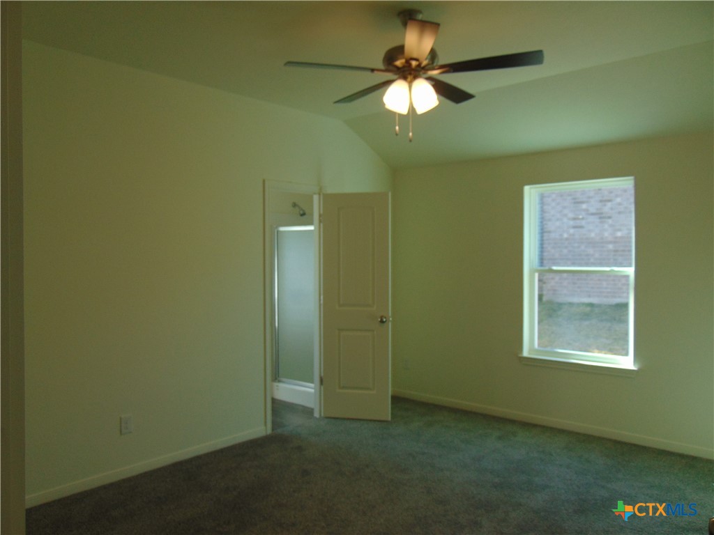 3202 Salt Fork Drive Killeen, TX 76549 - Photo 10 of 25 an empty room with windows and fan