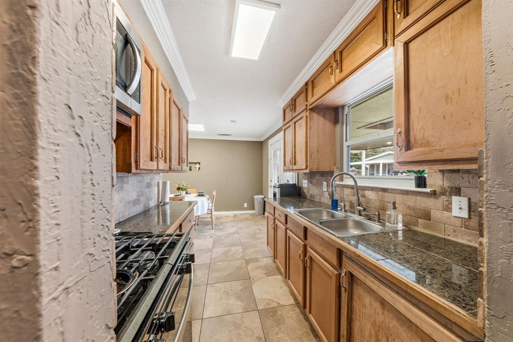 1530 Carson Drive Mesquite, TX 75149 - Photo 12 of 21 a kitchen that has a lot of cabinets in it