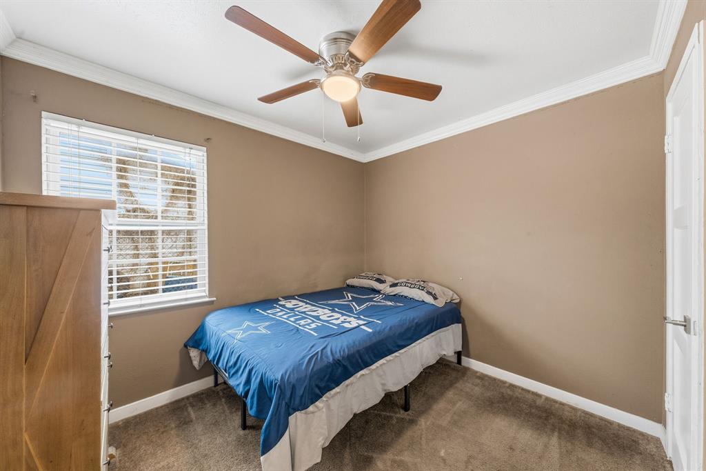 1530 Carson Drive Mesquite, TX 75149 - Photo 15 of 21 a bedroom with a bed and a ceiling fan