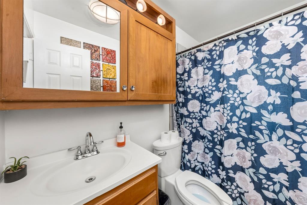 1530 Carson Drive Mesquite, TX 75149 - Photo 18 of 21 a bathroom with a sink toilet and shower curtain