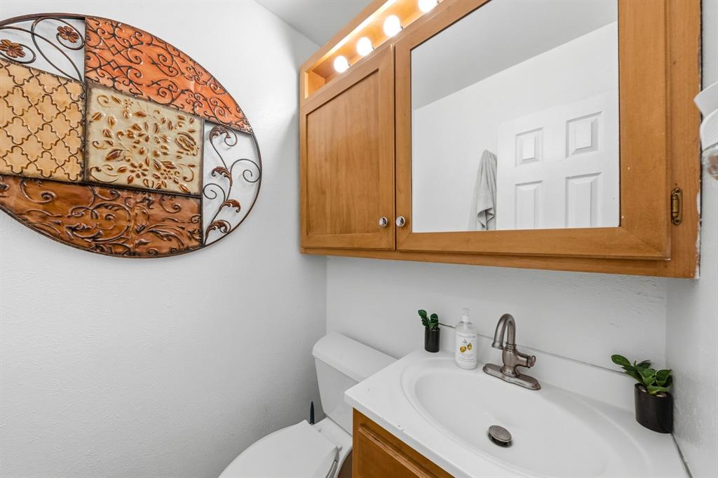 1530 Carson Drive Mesquite, TX 75149 - Photo 19 of 21 a bathroom with a sink and a mirror