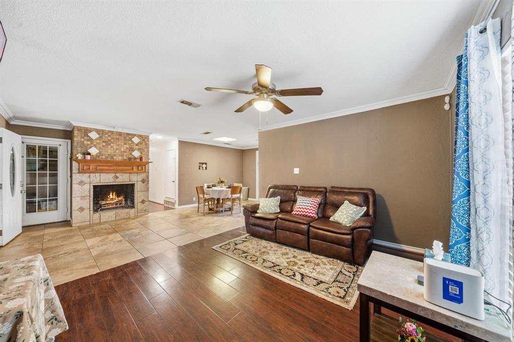 1530 Carson Drive Mesquite, TX 75149 - Photo 3 of 21 a living room with furniture and a fireplace