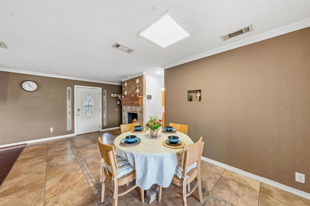 1530 Carson Drive Mesquite, TX 75149 - Photo 7 of 21 a view of a dining room with furniture and wooden floor