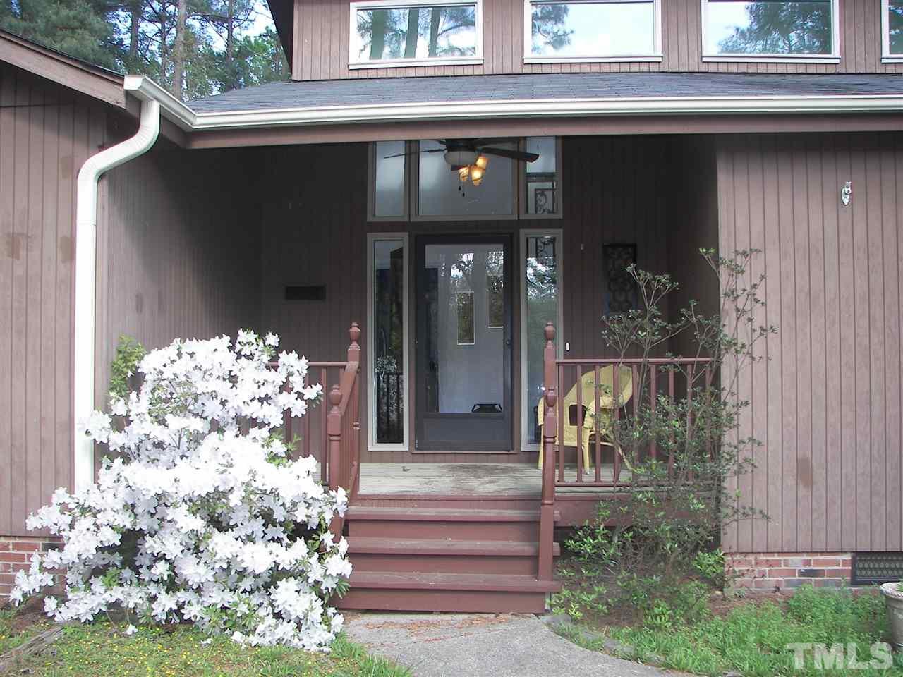 5016 Raintree Road Durham, NC 27712 - Photo 2 of 22 a front view of a house with a porch