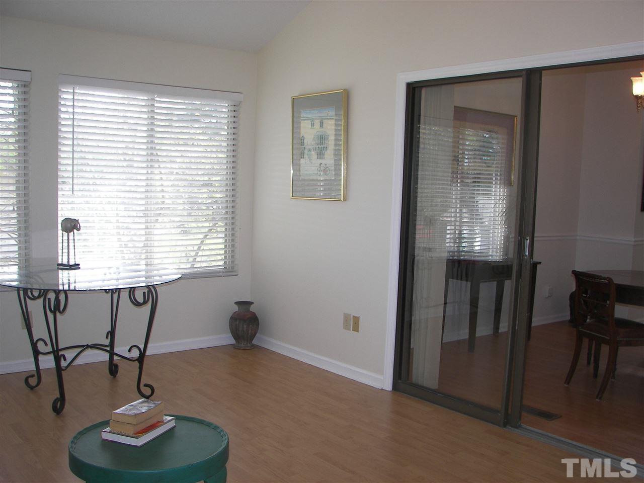 5016 Raintree Road Durham, NC 27712 - Photo 12 of 22 a living room with furniture and a window