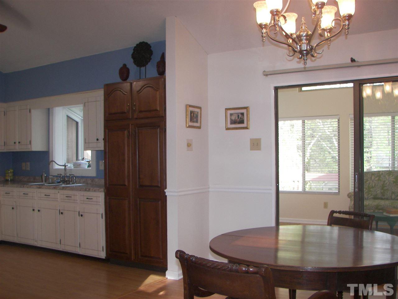5016 Raintree Road Durham, NC 27712 - Photo 14 of 22 a dining room with furniture and window