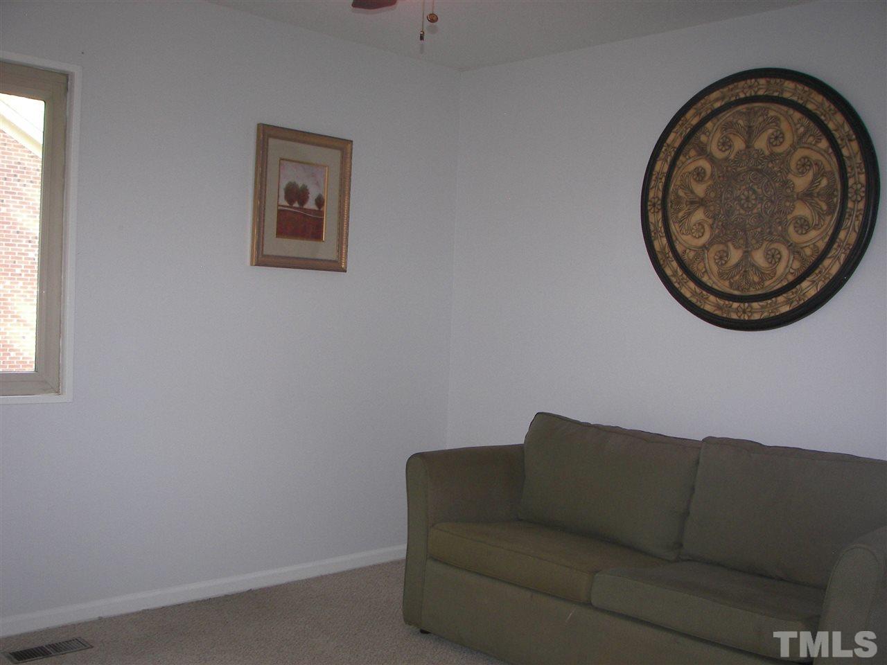5016 Raintree Road Durham, NC 27712 - Photo 19 of 22 a living room with a couch
