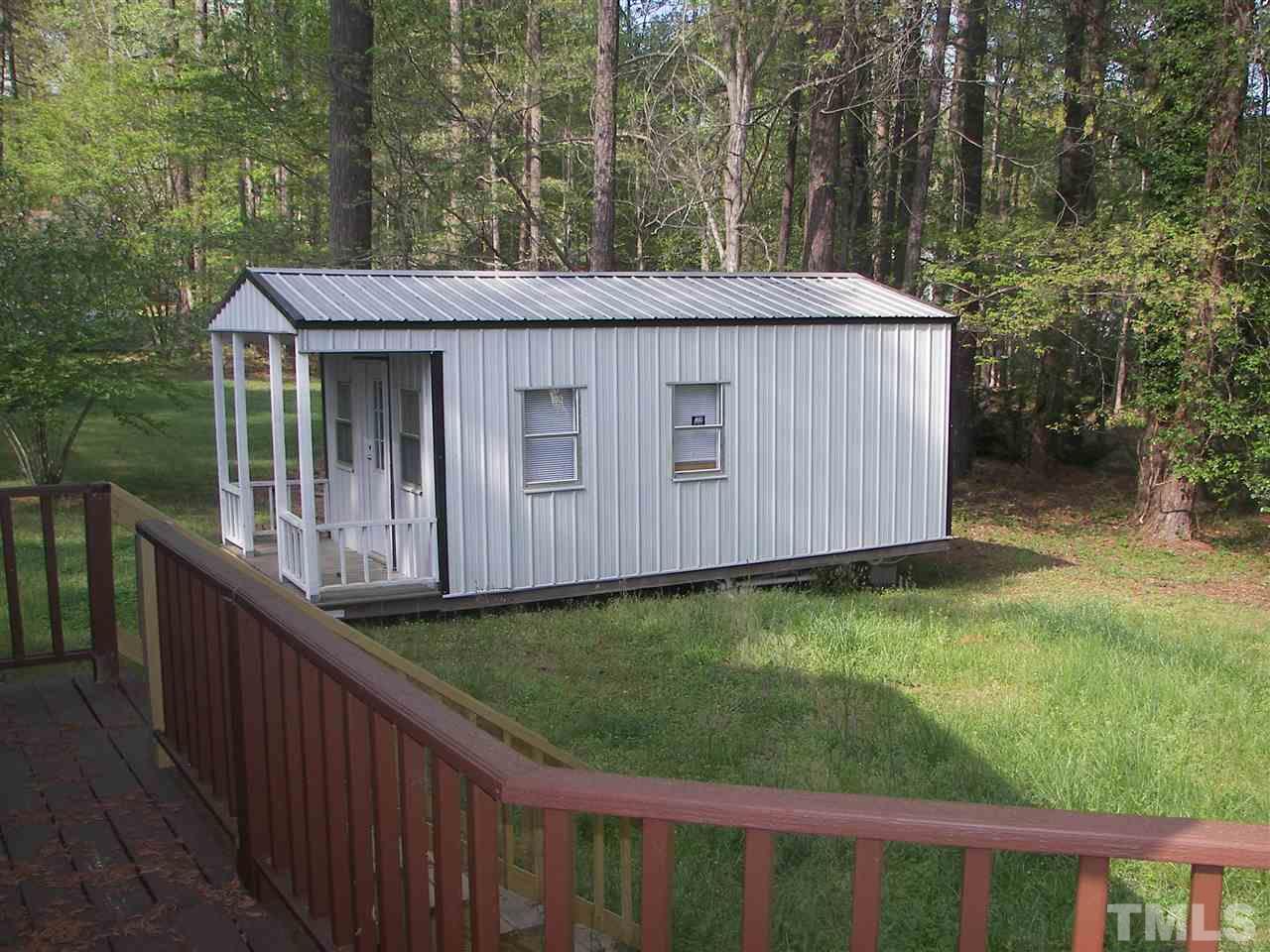 5016 Raintree Road Durham, NC 27712 - Photo 22 of 22 a view of a house with backyard