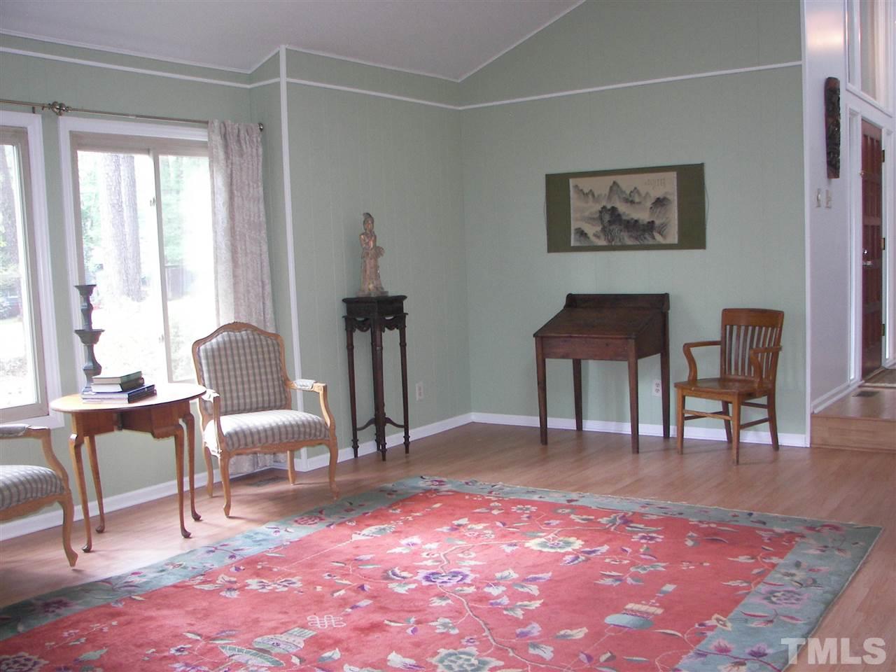 5016 Raintree Road Durham, NC 27712 - Photo 4 of 22 a living room with furniture rug and a window