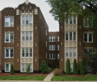 2838 West Addison Street, Unit 2S Chicago, IL 60618 - Photo 1 of 15 a front view of a residential apartment building with a yard