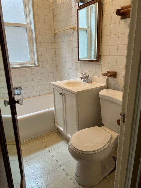 2838 West Addison Street, Unit 2S Chicago, IL 60618 - Photo 15 of 15 a white toilet sitting next to a bath tub