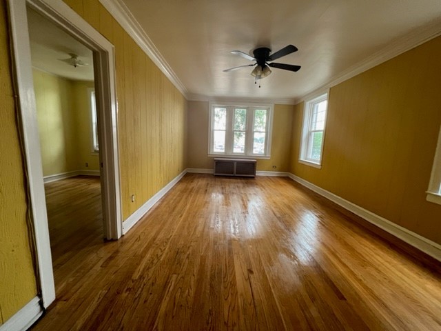 2838 West Addison Street, Unit 2S Chicago, IL 60618 - Photo 4 of 15 wooden floor in an empty room with a window