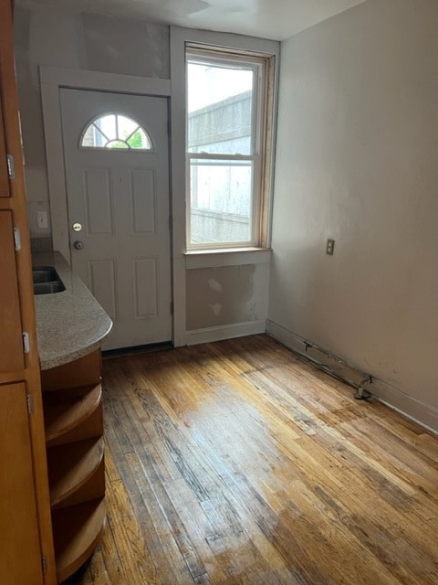 2838 West Addison Street, Unit 2S Chicago, IL 60618 - Photo 8 of 15 a view of empty room with wooden floor and fan