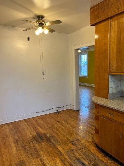2838 West Addison Street, Unit 2S Chicago, IL 60618 - Photo 10 of 15 a view of a room with wooden floor and white walls