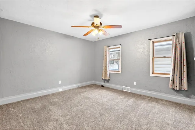 a room with window and chandelier