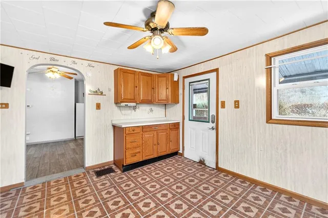 a kitchen with stainless steel appliances a refrigerator sink and cabinets