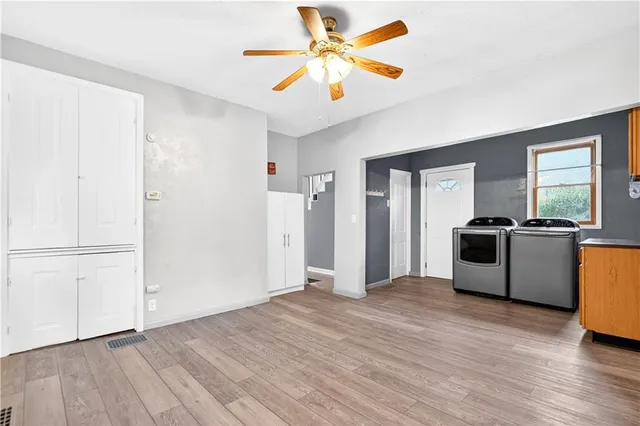 a view of kitchen with stainless steel appliances granite countertop a stove top oven a sink and a microwave