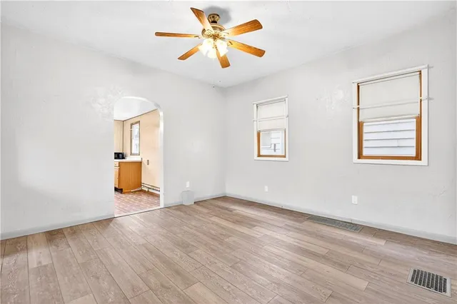 an empty room with large window