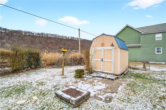 a view of balcony with wooden floor and seating space