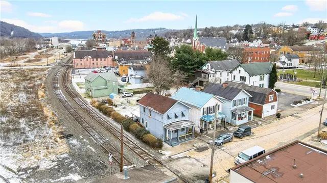 an aerial view of residential house with parking space